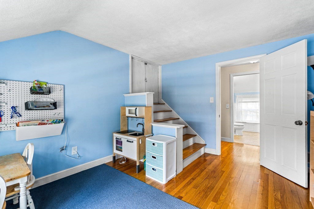 352 West Street Reading, MA 01867 - Photo 34 of 37 a room with furniture and stairs