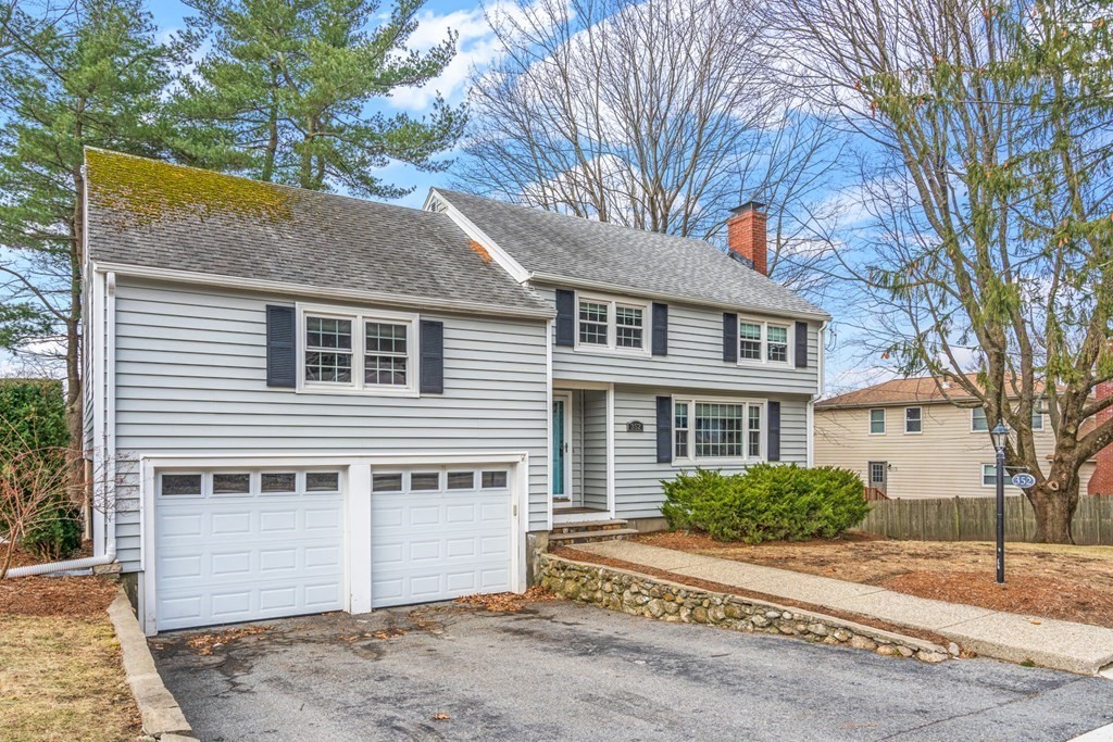 352 West Street Reading, MA 01867 - Photo 6 of 37 a house that has a tree in front of it