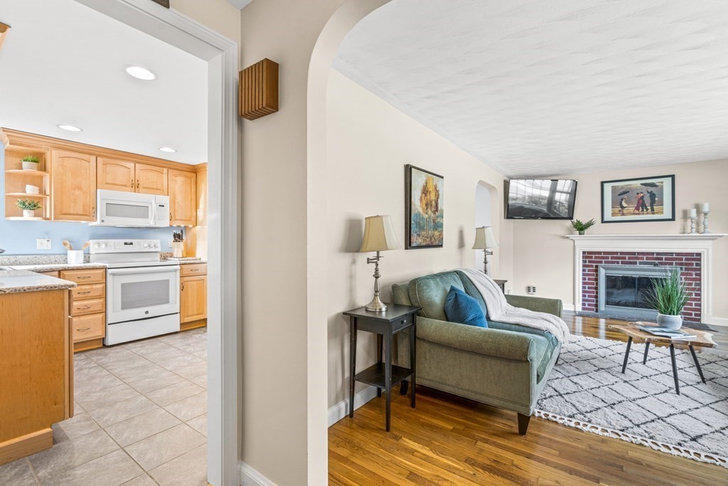 352 West Street Reading, MA 01867 - Photo 7 of 37 a living room with furniture and a fireplace
