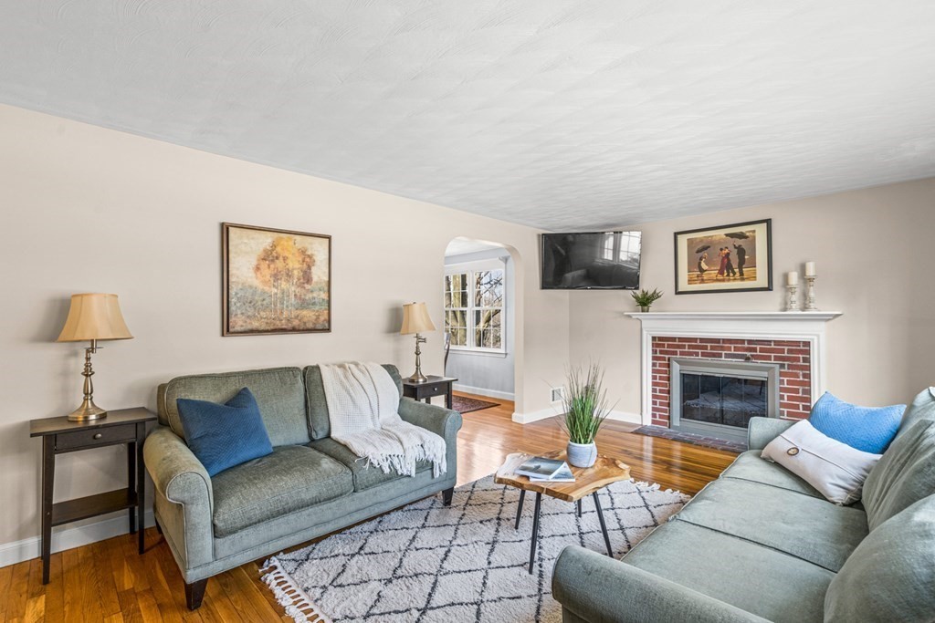 352 West Street Reading, MA 01867 - Photo 8 of 37 a living room with furniture and a fireplace