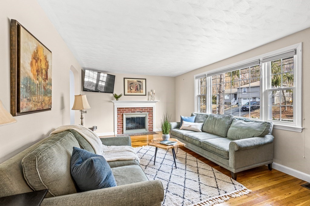 352 West Street Reading, MA 01867 - Photo 9 of 37 a living room with furniture and a fireplace