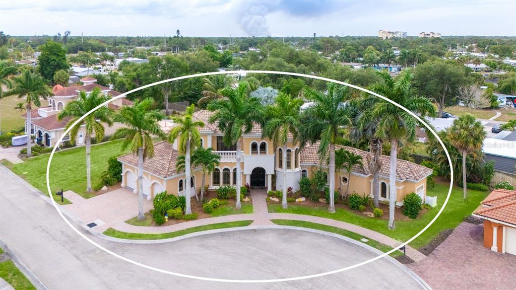 1630 Assisi Drive, Unit 18 Sarasota, FL 34231 - Photo 3 of 42 a view of a house with a park