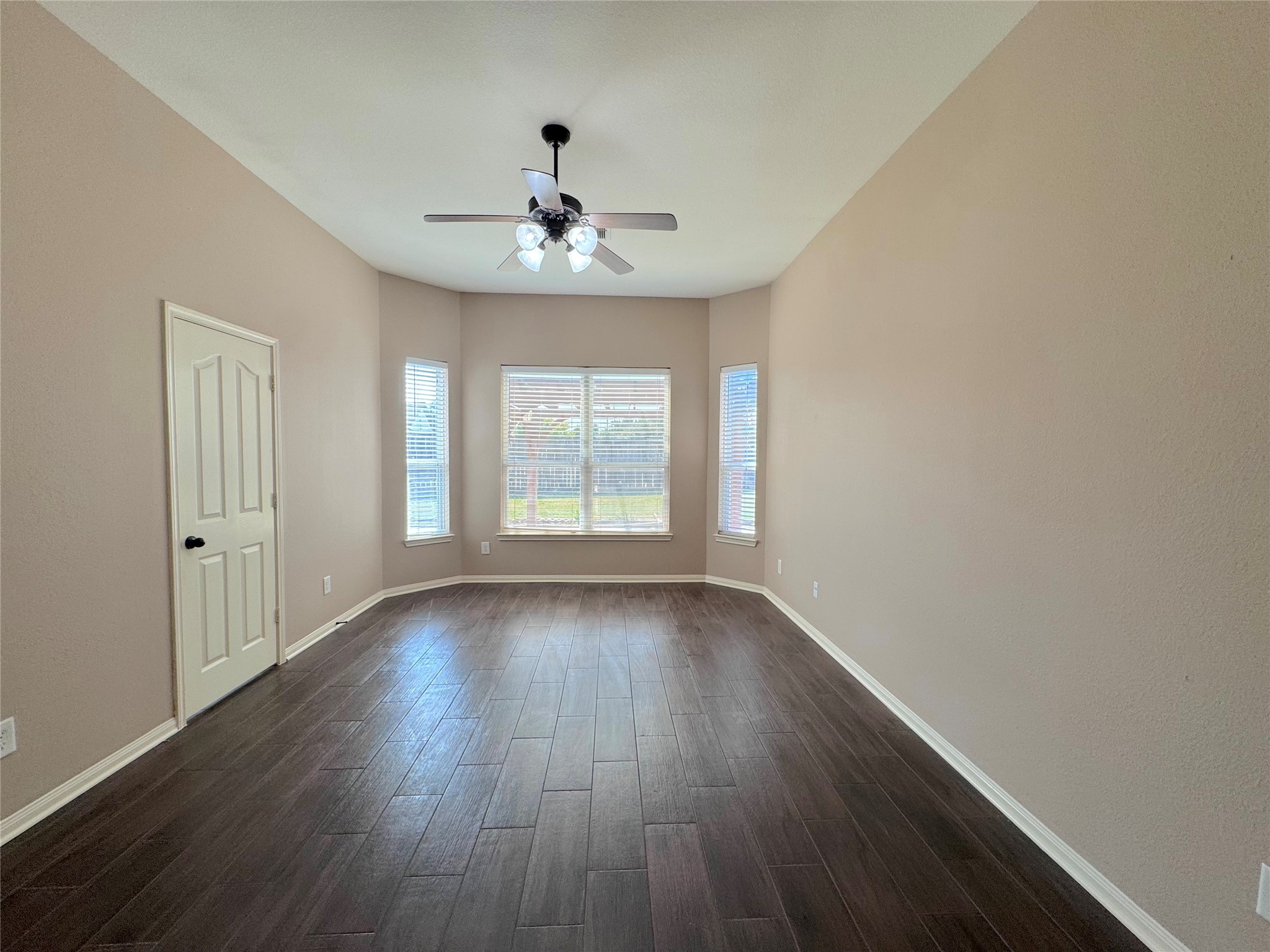 24039 Augusta Falls Lane Spring, TX 77389 - Photo 12 of 18 a view of an empty room with wooden floor and a window