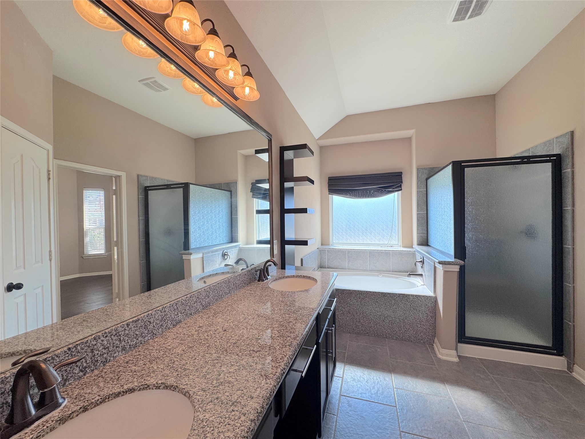 24039 Augusta Falls Lane Spring, TX 77389 - Photo 13 of 18 a bathroom with a granite countertop sink and a mirror