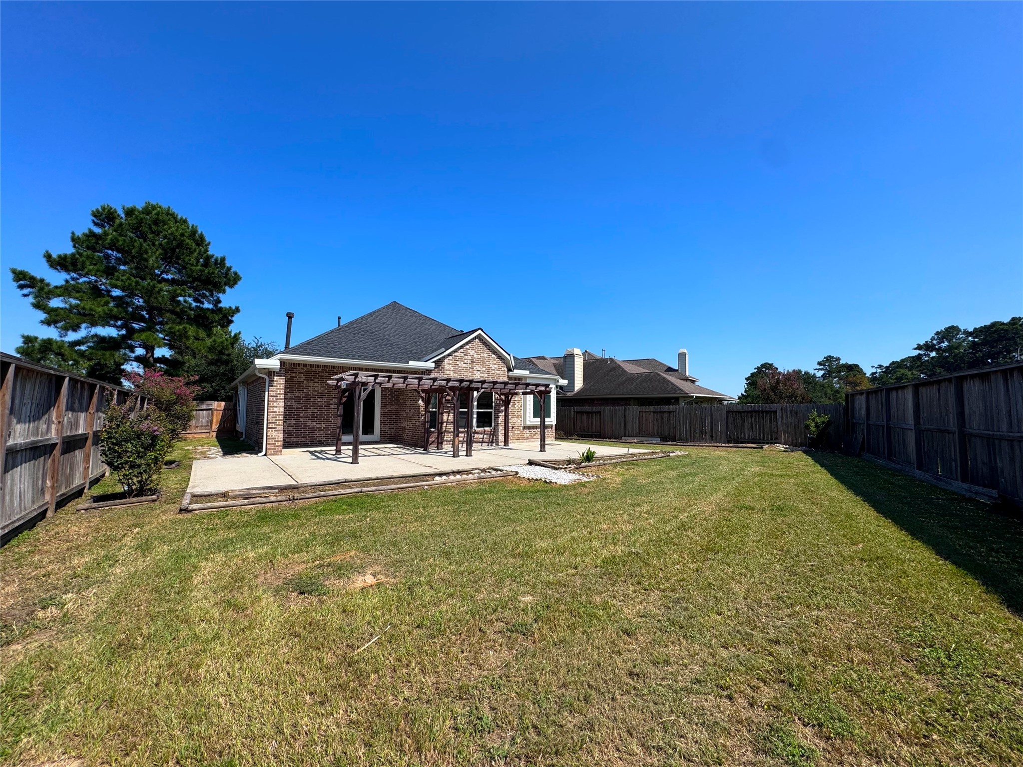 24039 Augusta Falls Lane Spring, TX 77389 - Photo 18 of 18 a front view of a house with a garden