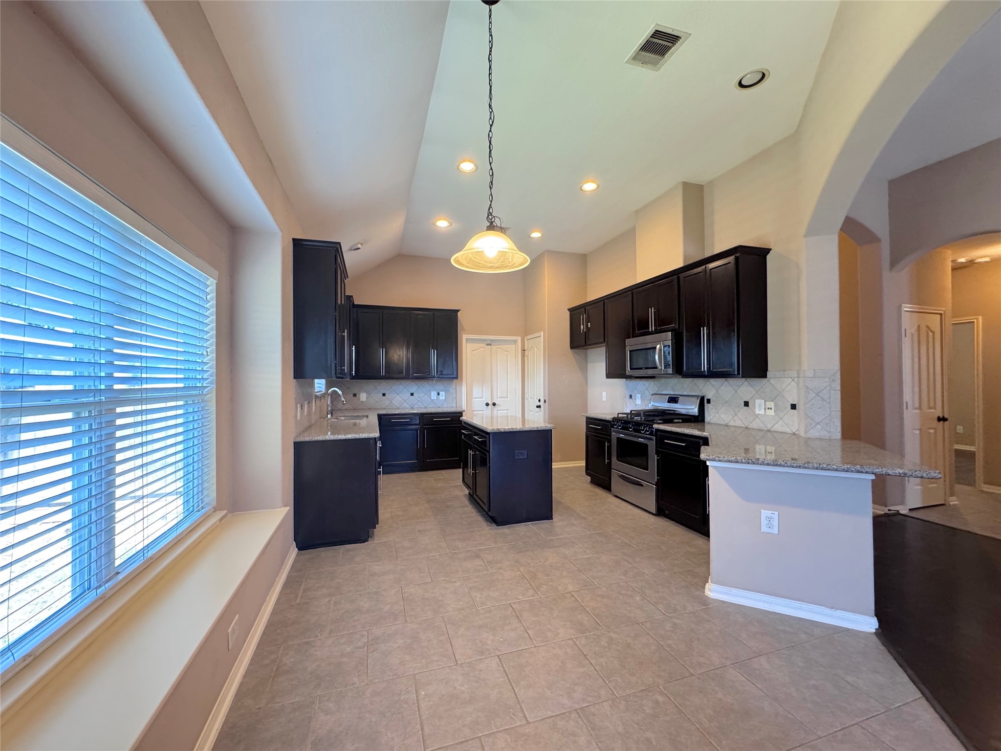 24039 Augusta Falls Lane Spring, TX 77389 - Photo 8 of 18 a large kitchen with a large window in it