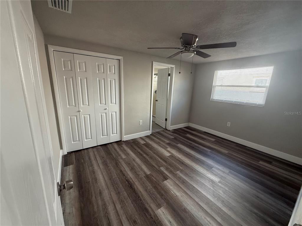 7104 Ingleside Drive Port Richey, FL 34668 - Photo 11 of 14 wooden floor in an empty room