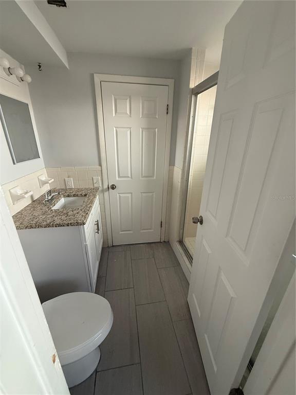 7104 Ingleside Drive Port Richey, FL 34668 - Photo 12 of 14 a bathroom with a sink toilet and shower