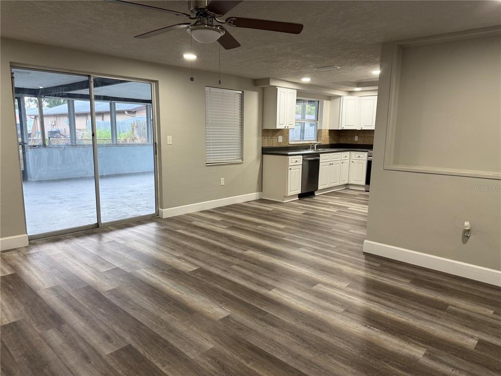 7104 Ingleside Drive Port Richey, FL 34668 - Photo 3 of 14 a view of a kitchen with wooden floor