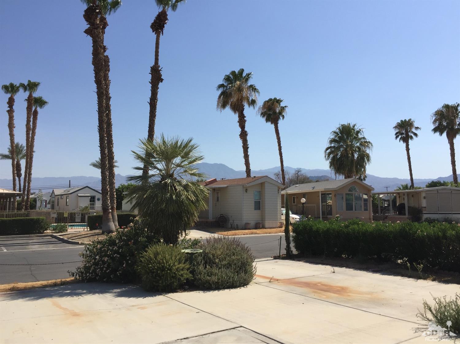 81620 Ave 49, Unit 131A Indio, CA 92201 - Photo 4 of 8 a view of a garden with a fountain