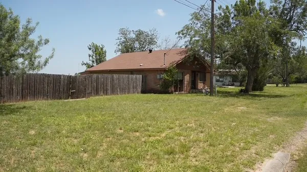 a view of a yard in front of a house