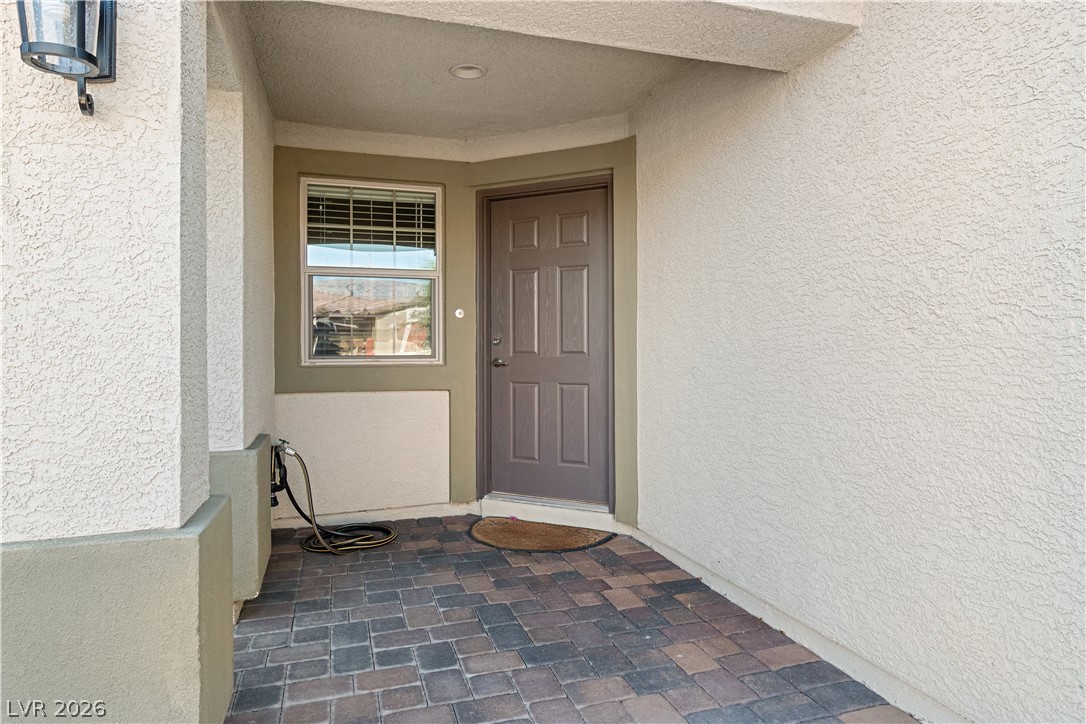 2269 Chandler Ranch Place Laughlin, NV 89029 - Photo 3 of 96 Doorway to property with stucco siding