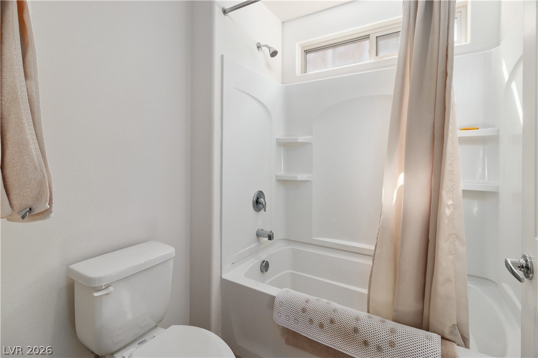 2269 Chandler Ranch Place Laughlin, NV 89029 - Photo 35 of 96 Bathroom featuring shower / tub combo with curtain and toilet