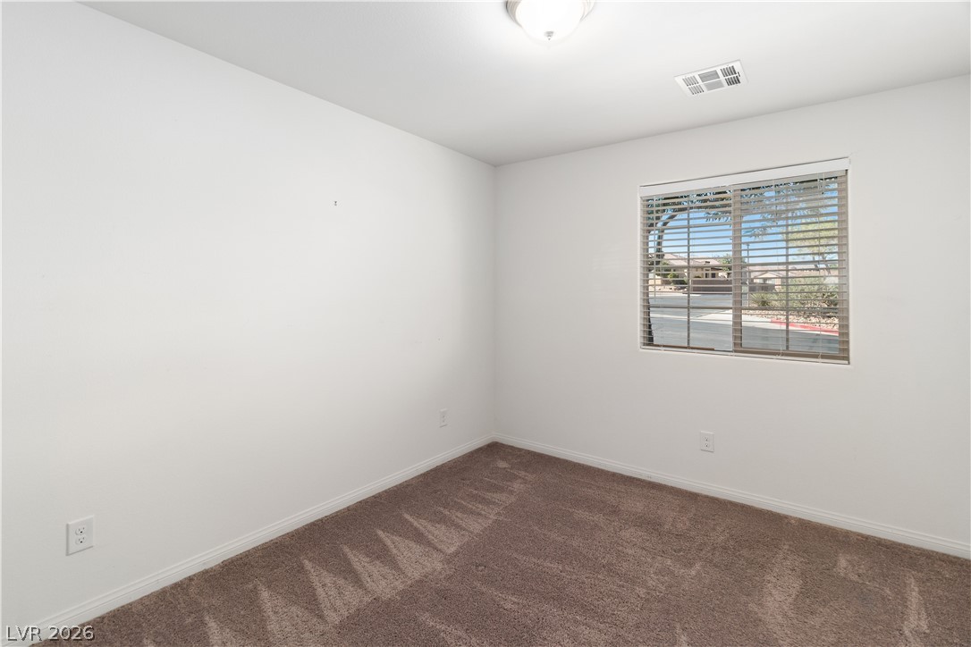 2269 Chandler Ranch Place Laughlin, NV 89029 - Photo 36 of 96 Bedroom with dark colored carpet and baseboards