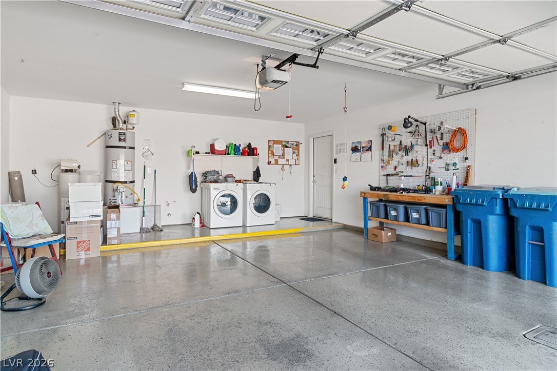 2269 Chandler Ranch Place Laughlin, NV 89029 - Photo 42 of 96 Garage with a workshop area, water heater, washer and dryer, and a garage door opener