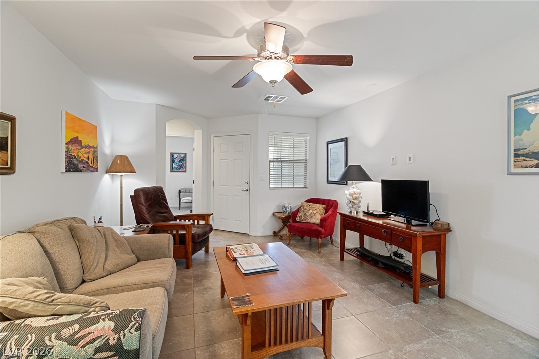 2269 Chandler Ranch Place Laughlin, NV 89029 - Photo 5 of 96 Tiled living area with ceiling fan and arched walkways
