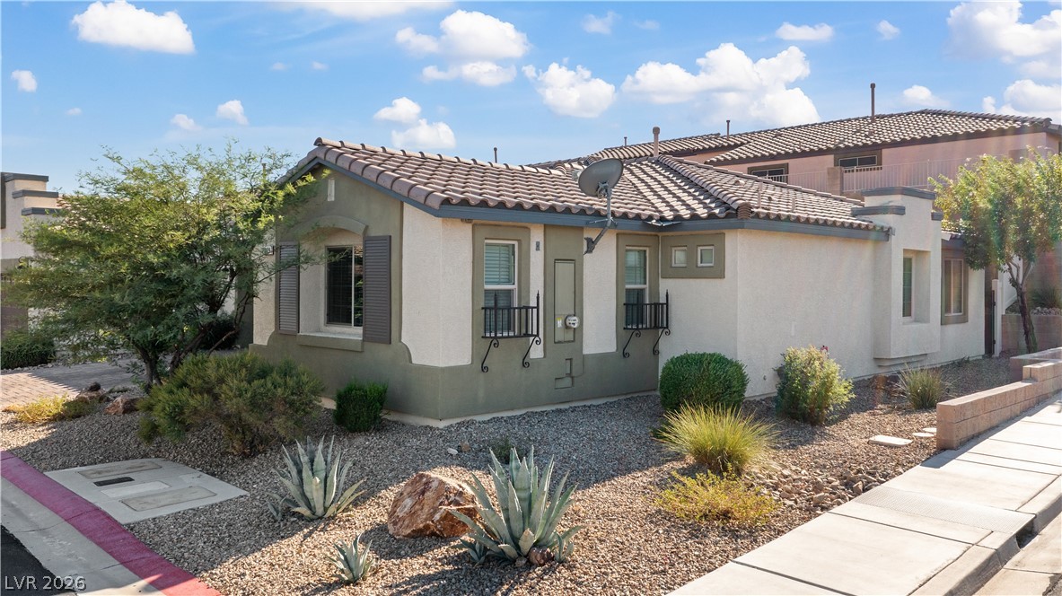 2269 Chandler Ranch Place Laughlin, NV 89029 - Photo 60 of 96 View of home's exterior featuring stucco siding and a tiled roof
