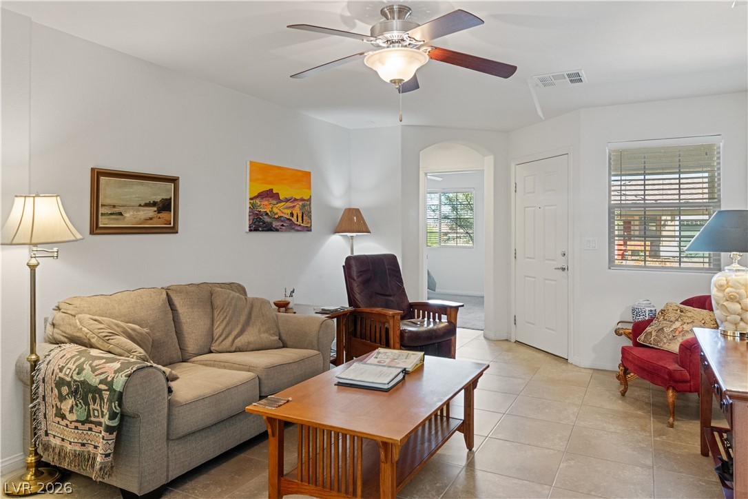 2269 Chandler Ranch Place Laughlin, NV 89029 - Photo 7 of 96 Living area featuring light tile patterned floors, ceiling fan, and arched walkways