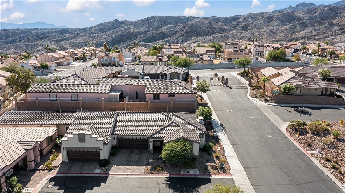 2269 Chandler Ranch Place Laughlin, NV 89029 - Photo 73 of 96 Aerial perspective of suburban area with a mountain backdrop