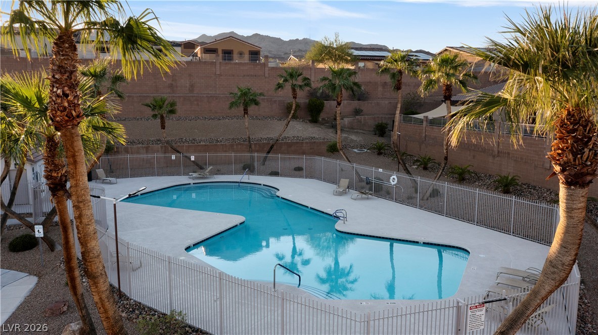 2269 Chandler Ranch Place Laughlin, NV 89029 - Photo 83 of 96 Community pool featuring a fenced backyard and a patio