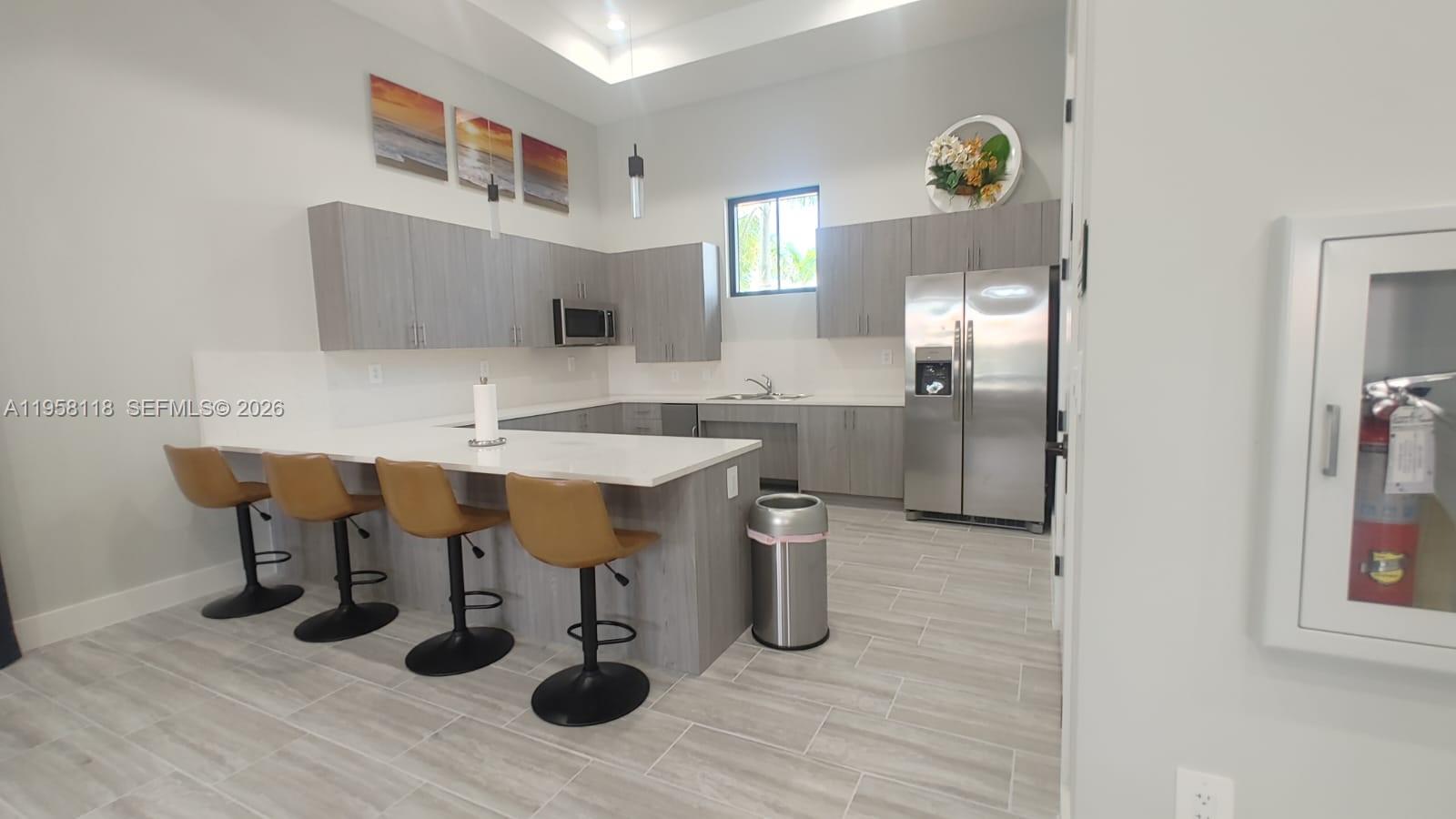 13313 Southwest 287th Terrace Homestead, FL 33033 - Photo 18 of 26 a kitchen with a sink appliances and cabinets
