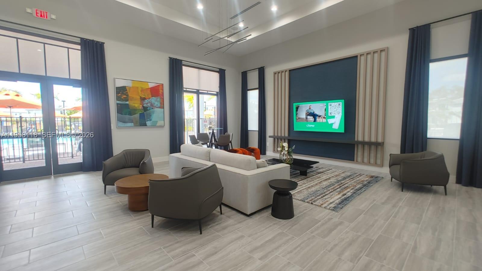 13313 Southwest 287th Terrace Homestead, FL 33033 - Photo 19 of 26 a living room with furniture and a flat screen tv