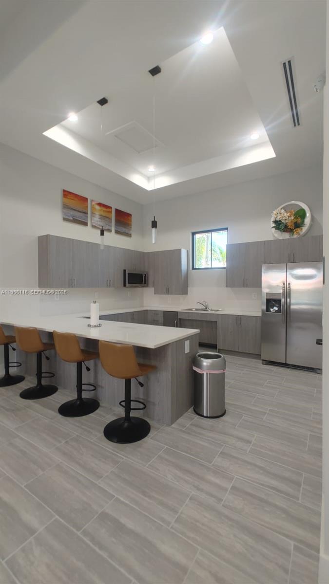 13313 Southwest 287th Terrace Homestead, FL 33033 - Photo 20 of 26 a kitchen with stainless steel appliances a stove and cabinets