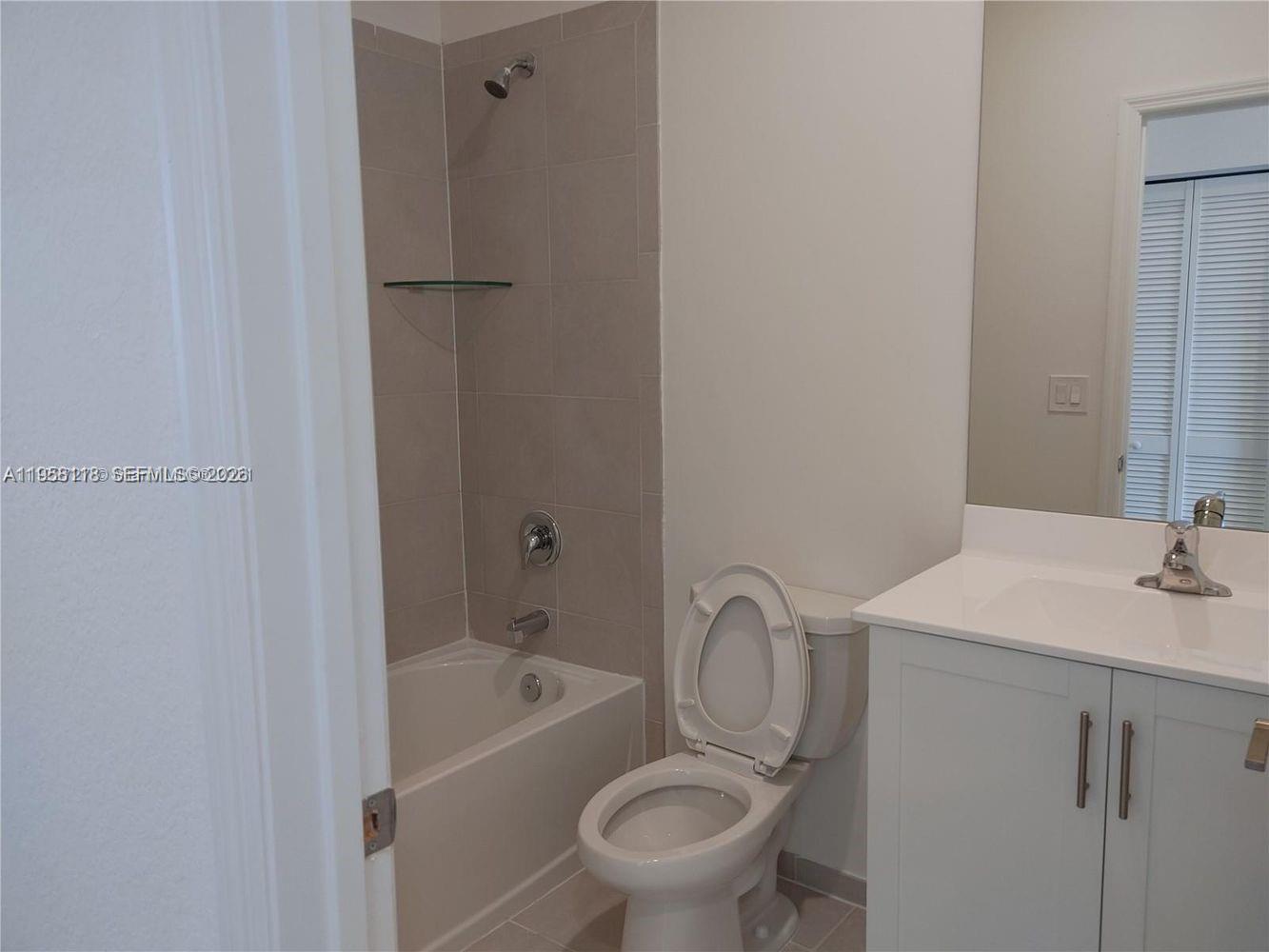 13313 Southwest 287th Terrace Homestead, FL 33033 - Photo 7 of 26 a bathroom with a sink toilet and shower