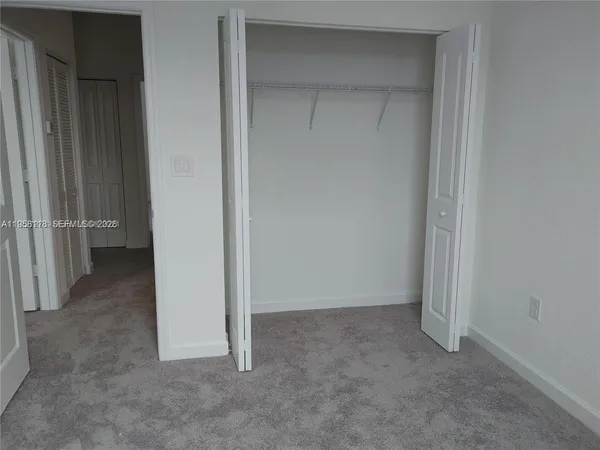 a room with a sink and a mirror