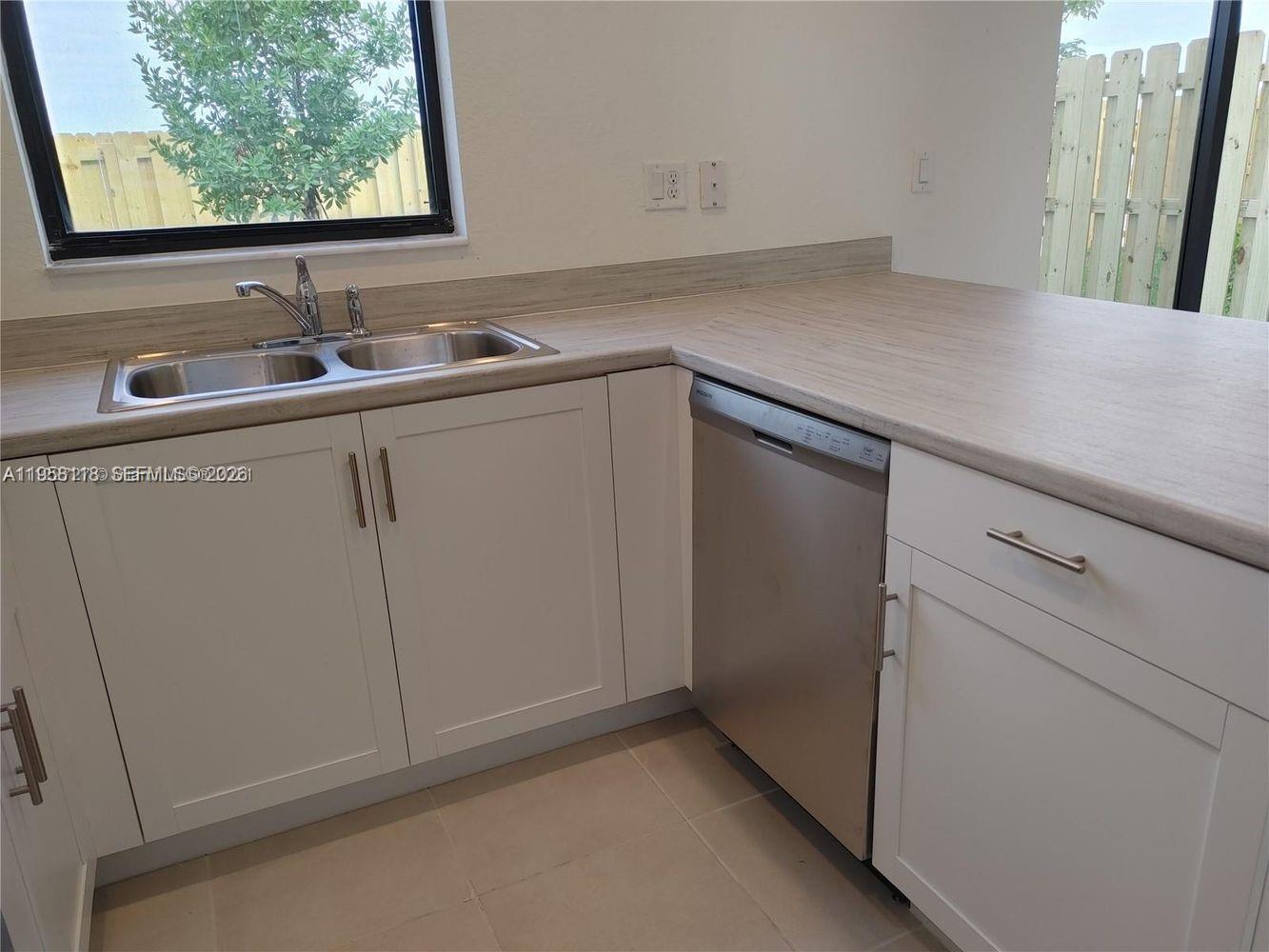 13313 Southwest 287th Terrace Homestead, FL 33033 - Photo 9 of 26 a room with a sink and a mirror