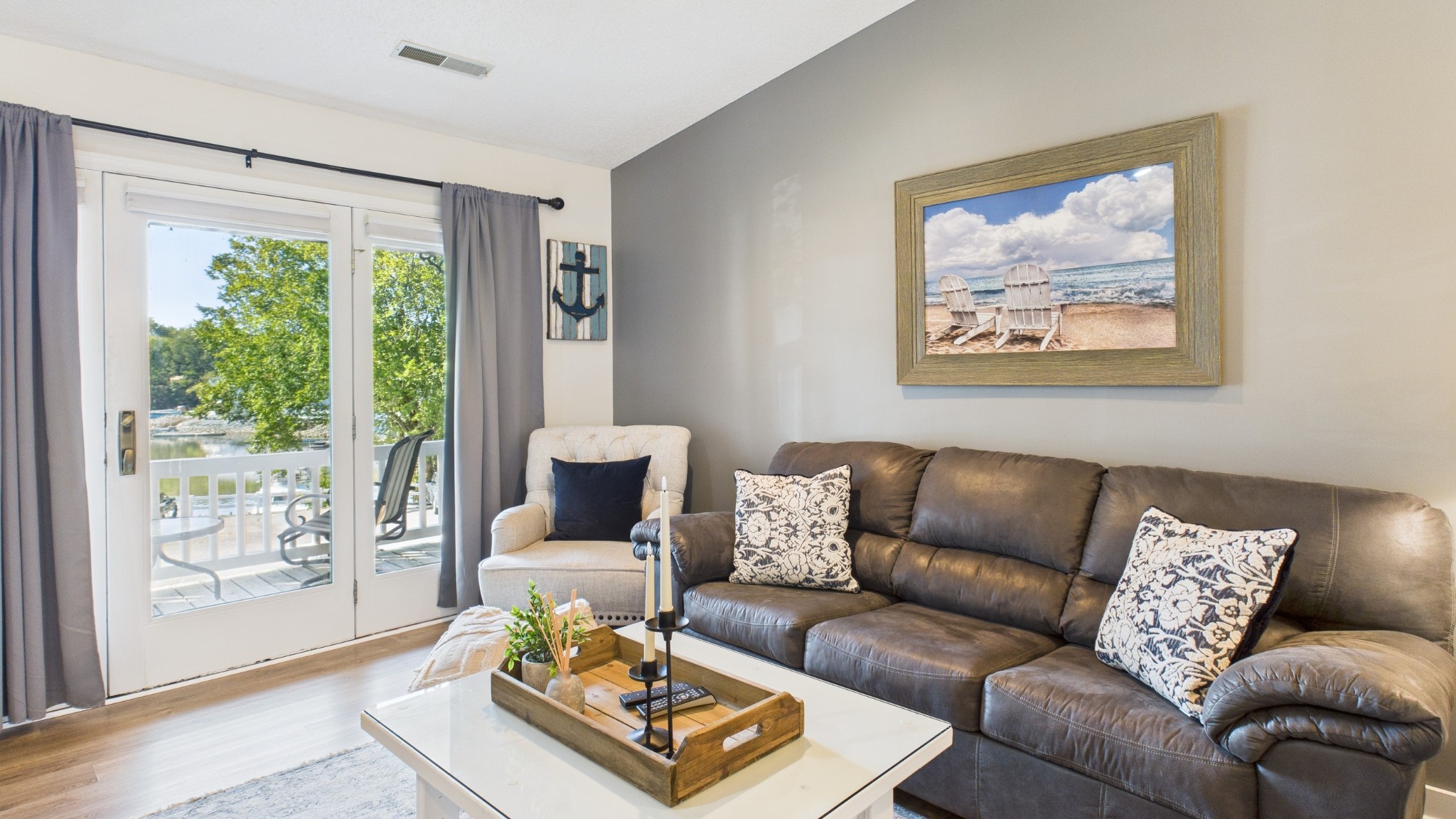 103 Harbor View Drive Grand Rivers, KY 42045 - Photo 11 of 38 a living room with furniture and a large window