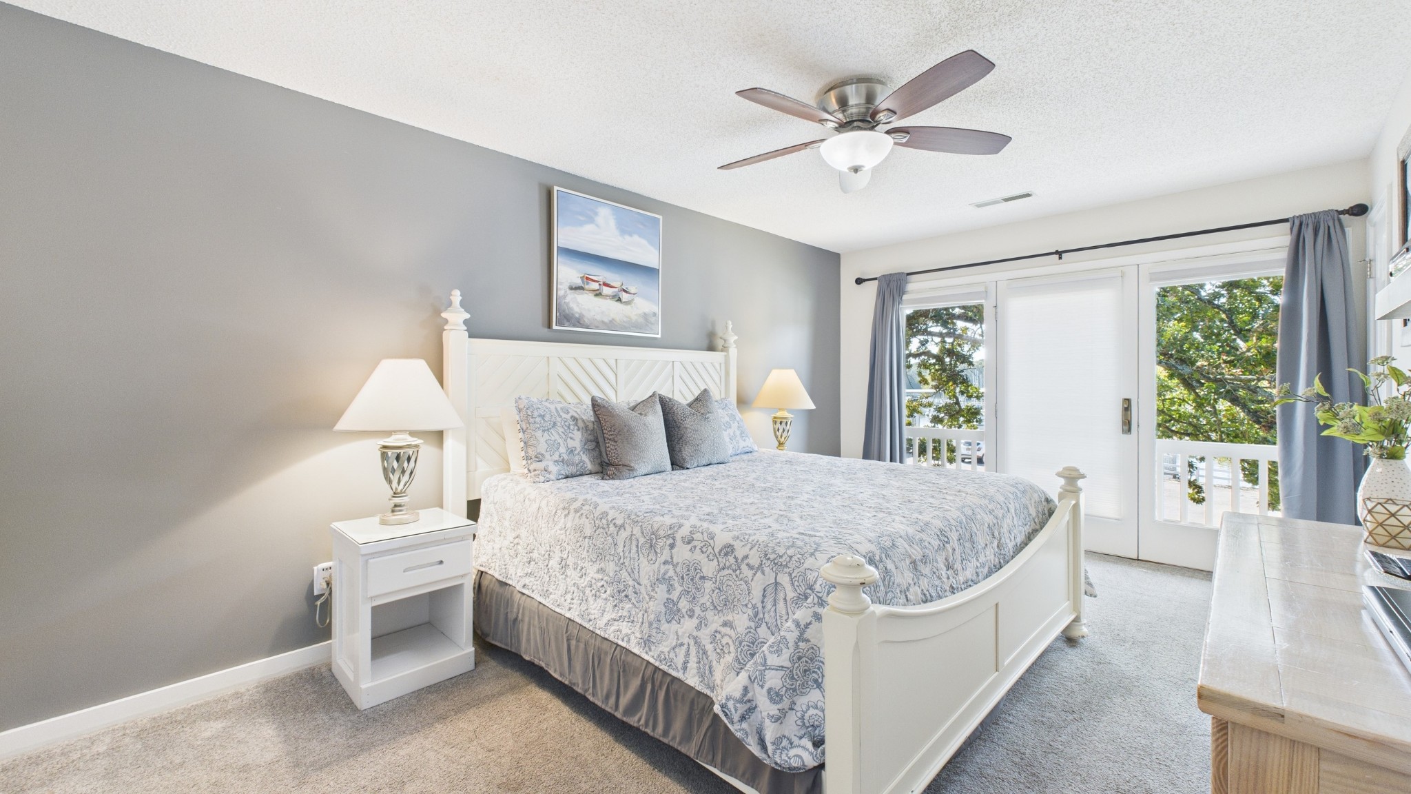 103 Harbor View Drive Grand Rivers, KY 42045 - Photo 15 of 38 a bedroom with a large bed and a chandelier