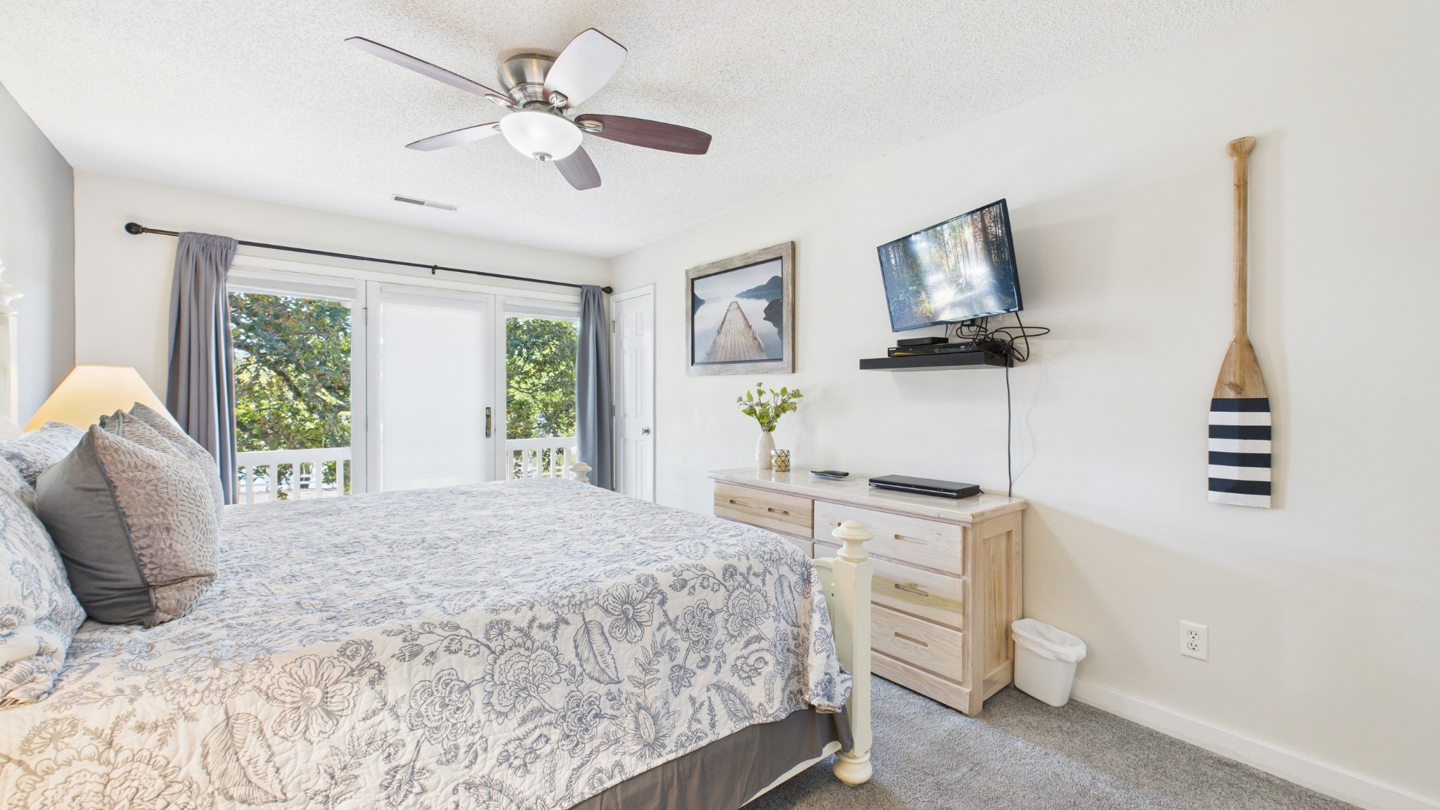 103 Harbor View Drive Grand Rivers, KY 42045 - Photo 20 of 38 a bedroom with a bed a flat screen tv and a window