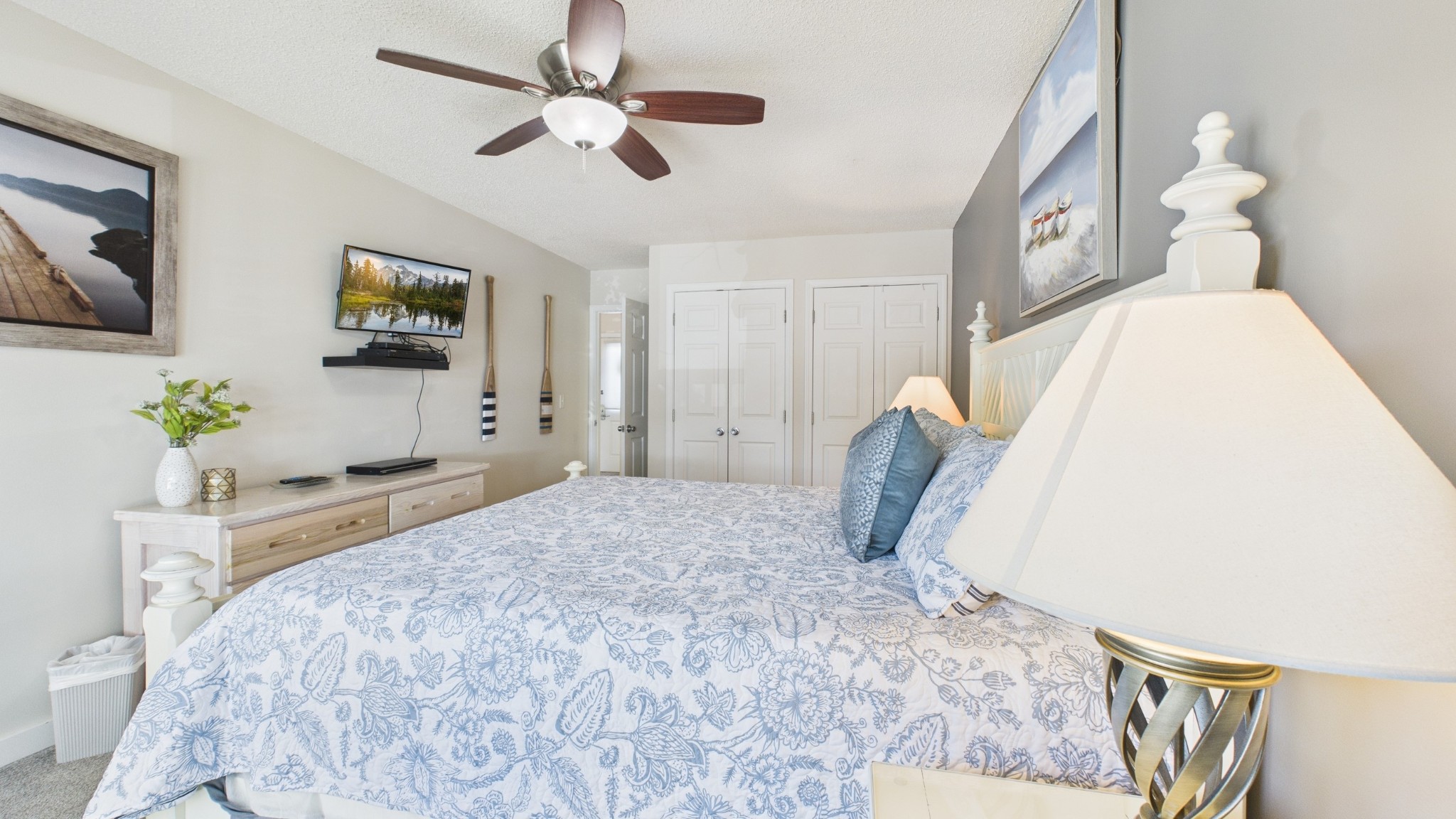 103 Harbor View Drive Grand Rivers, KY 42045 - Photo 22 of 38 a bedroom with a large bed and a chandelier