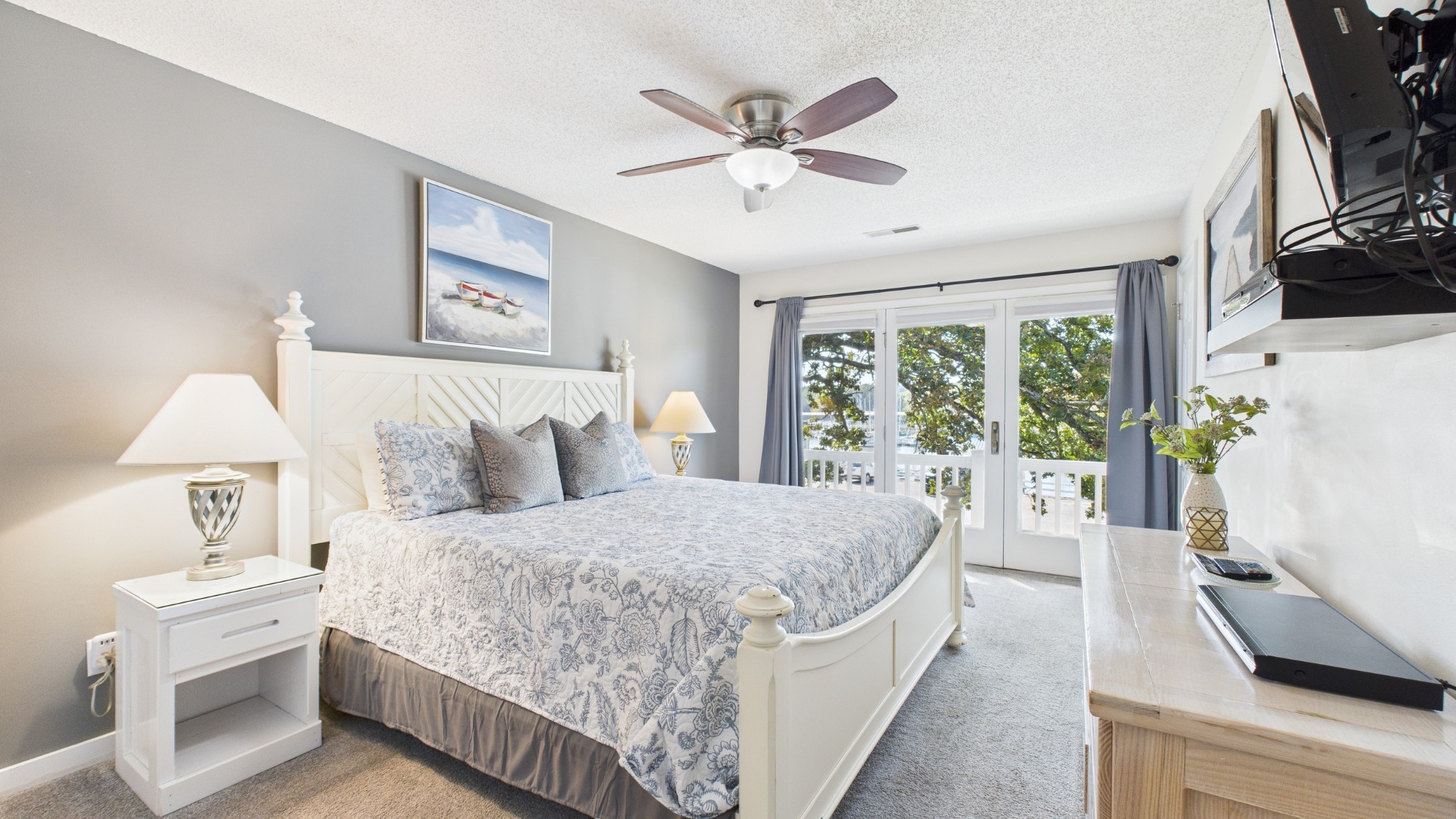 103 Harbor View Drive Grand Rivers, KY 42045 - Photo 25 of 38 a bedroom with a large bed and a chandelier