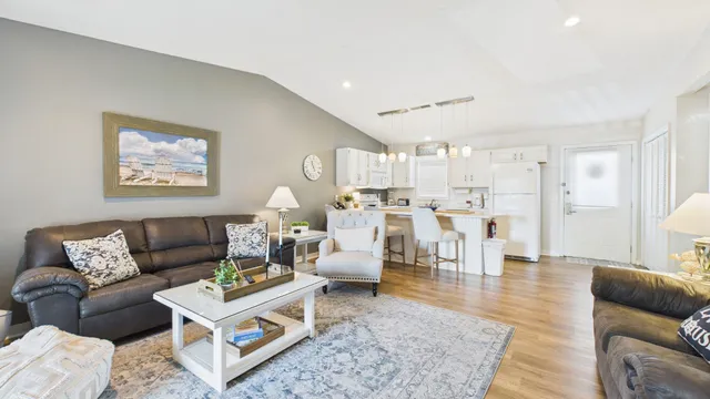 a kitchen with a sink a stove and chairs