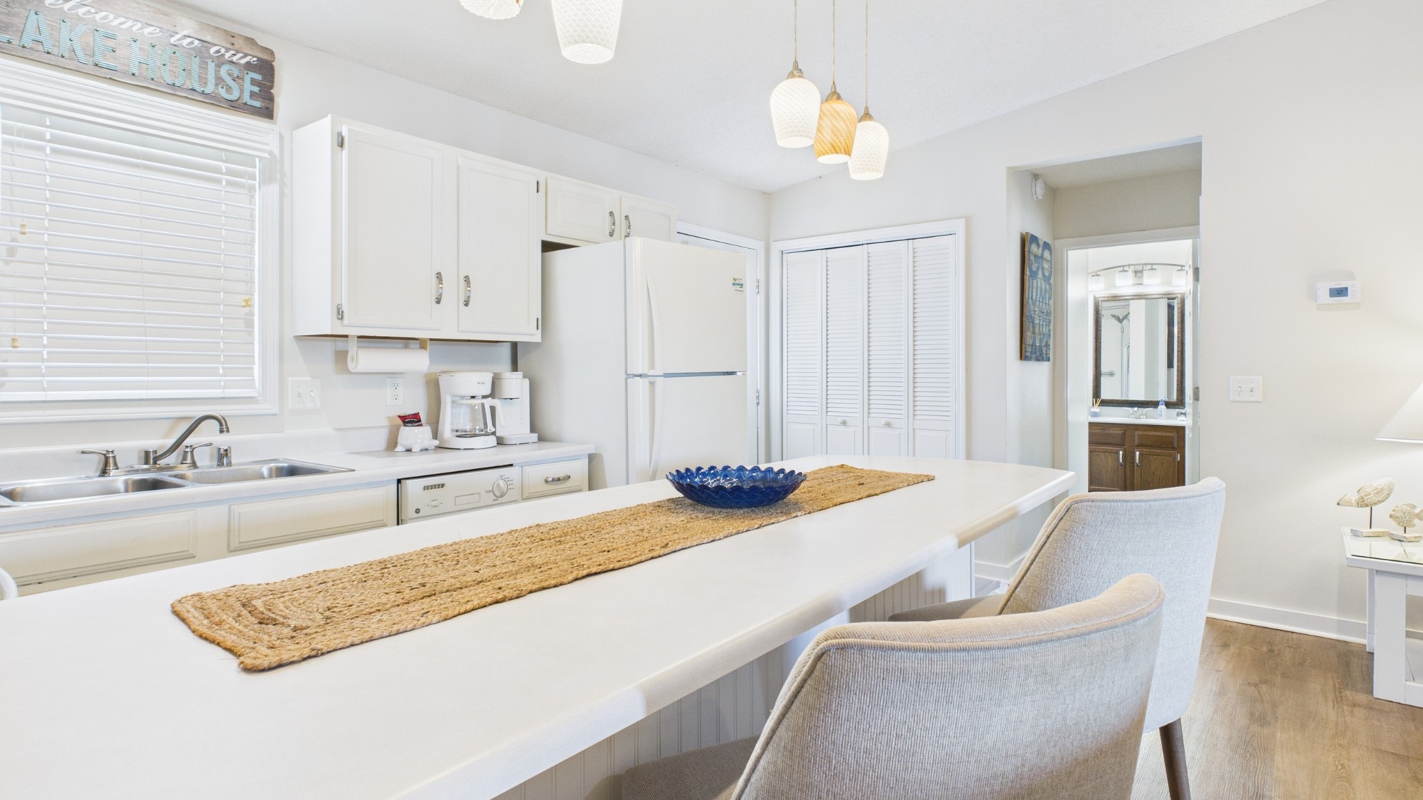 103 Harbor View Drive Grand Rivers, KY 42045 - Photo 33 of 38 a kitchen with a sink a stove and chairs