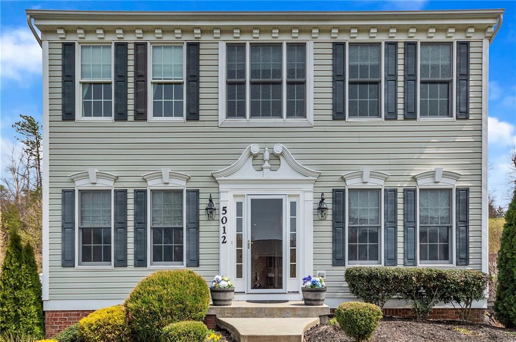 5012 Silver Oaks Drive McKees Rocks, PA 15136 - Photo 2 of 25 front view of a brick house with a large window