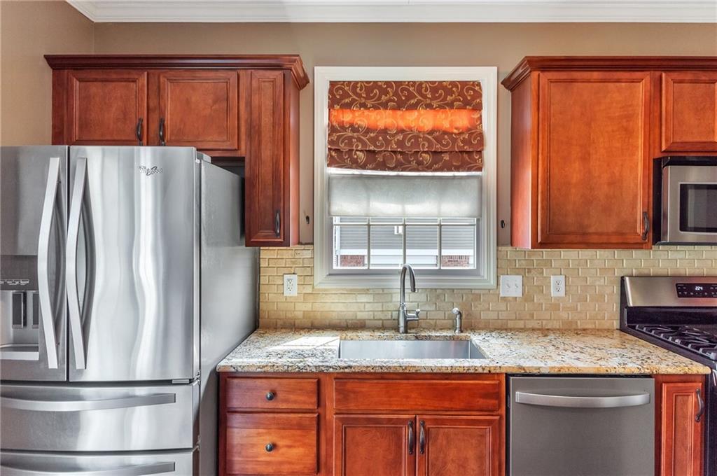 5012 Silver Oaks Drive McKees Rocks, PA 15136 - Photo 11 of 25 a kitchen with stainless steel appliances granite countertop a refrigerator and a sink