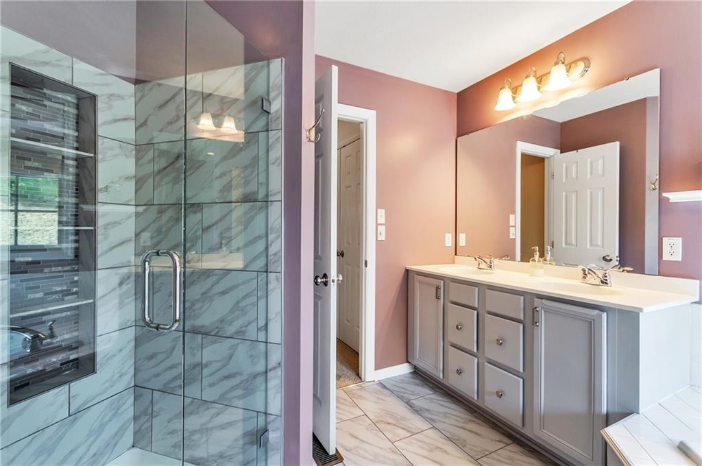 5012 Silver Oaks Drive McKees Rocks, PA 15136 - Photo 17 of 25 a bathroom with a double vanity sink and a mirror