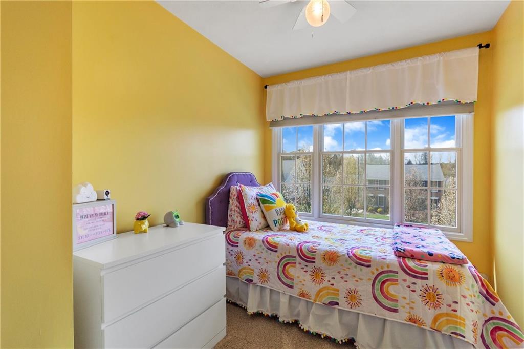 5012 Silver Oaks Drive McKees Rocks, PA 15136 - Photo 19 of 25 a bedroom with a bed and large windows