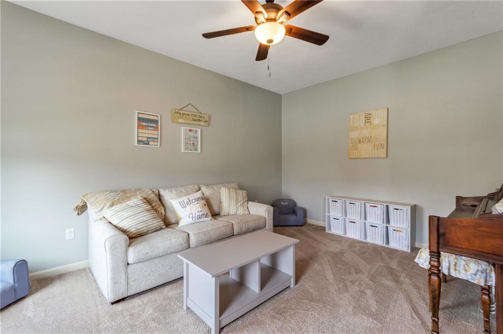 5012 Silver Oaks Drive McKees Rocks, PA 15136 - Photo 5 of 25 a living room with furniture and a bookshelf