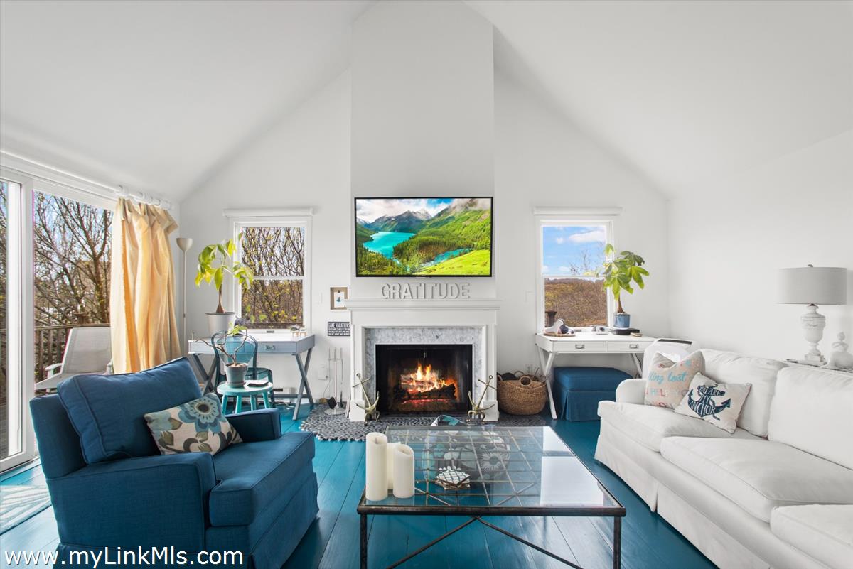 13 Parson Lane Nantucket, MA 02554 - Photo 25 of 44 a living room with furniture a fireplace and a flat screen tv