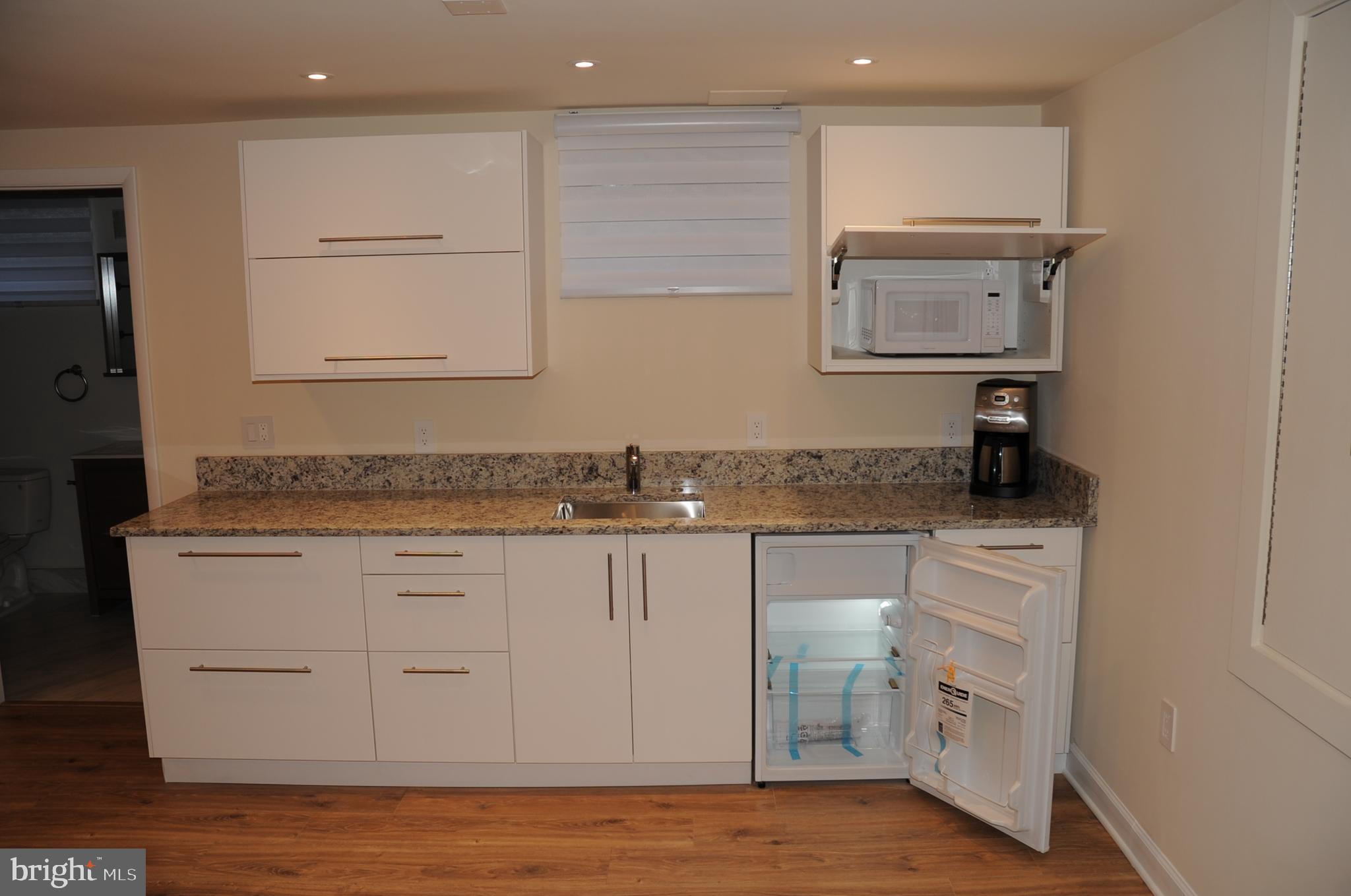 16632 Alden Avenue Gaithersburg, MD 20877 - Photo 37 of 57 Kitchenette with refrigerator and microwave
