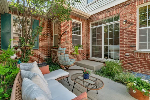 a view of a patio with couches and potted plants