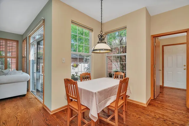 a view of a dining room with furniture window and wooden floor