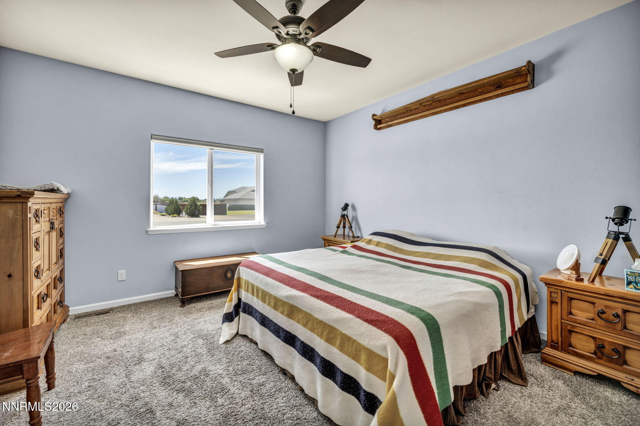 1286 Sky Ridge Drive Fallon, NV 89406 - Photo 29 of 49 a bedroom with a bed and a chandelier