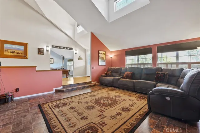a living room with furniture rug and window