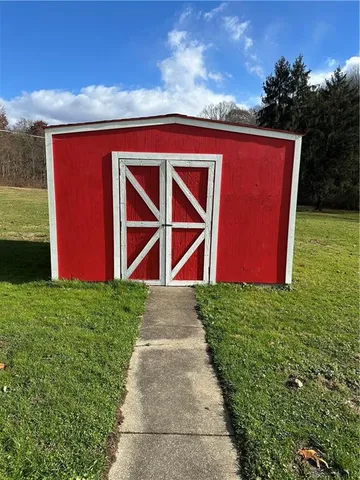 a backyard of a house with lots of green space