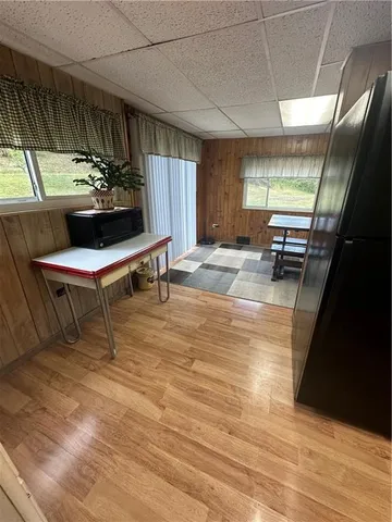 a living room with a couch and chandelier